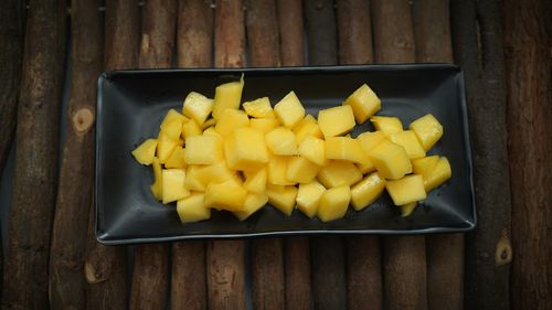 High angle view of yellow fruits on table