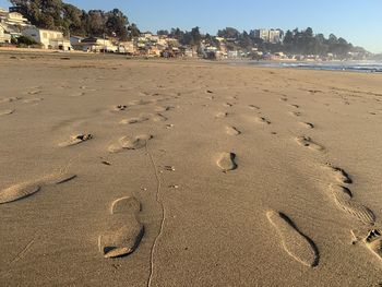 High angle view of footprints on beach