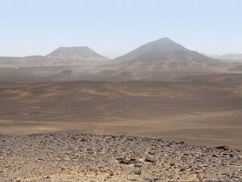 Scenic view of desert against clear sky