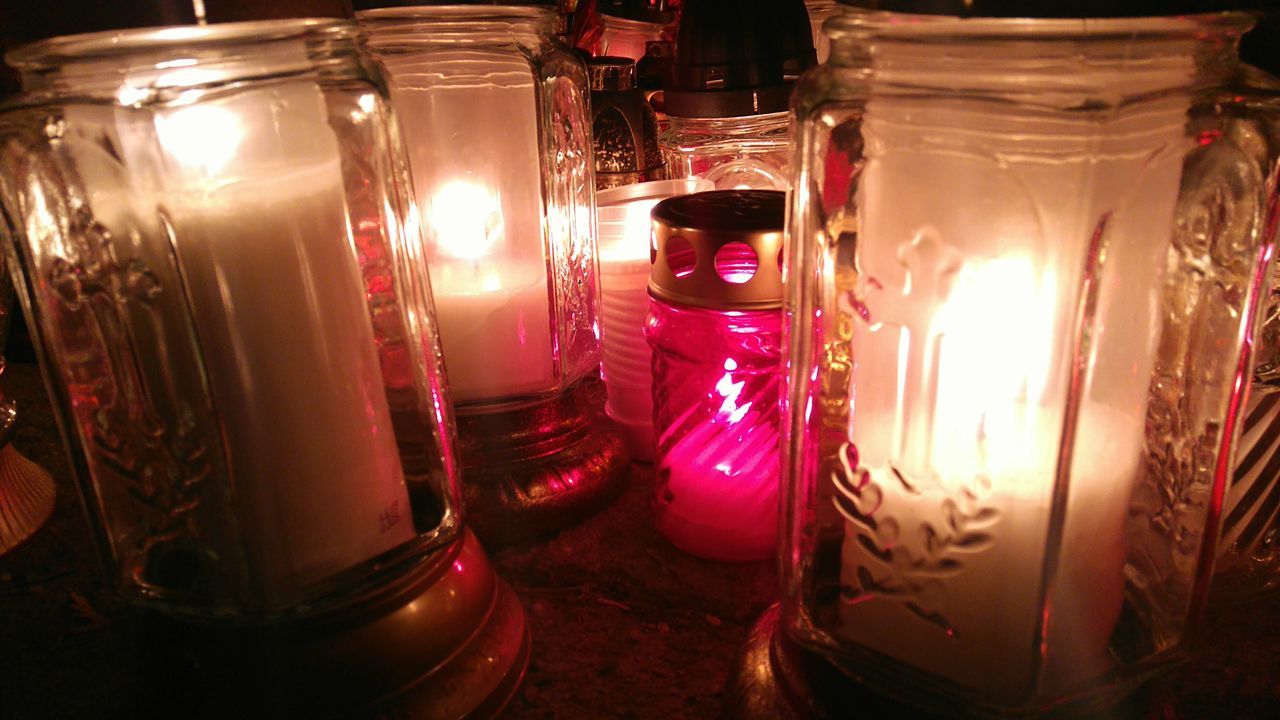 illuminated, indoors, glass - material, night, transparent, no people, table, lighting equipment, close-up, still life, glowing, sunlight, absence, light - natural phenomenon, lens flare, dark, window, orange color, empty, reflection