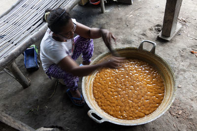 High angle view of man preparing food