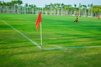 Golf course on field against sky