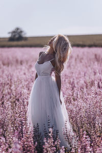 Full length of woman standing on field