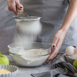 Midsection of man preparing food in kitchen