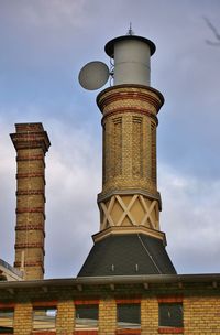 Low angle view of chimney against sky