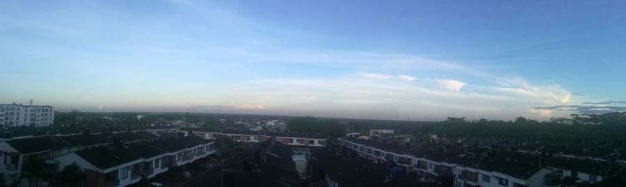 High angle view of buildings in city against sky