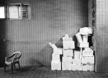 Chairs on table against wall