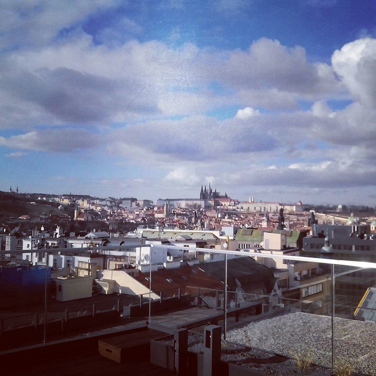 building exterior, architecture, built structure, sky, city, cityscape, cloud - sky, residential district, residential structure, residential building, high angle view, crowded, cloud, cloudy, roof, town, harbor, outdoors, house, day