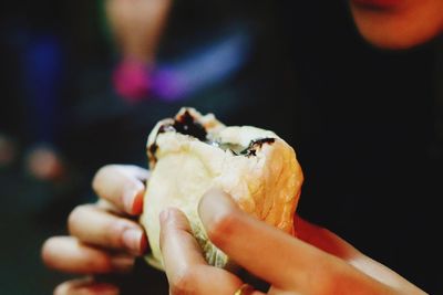 Close-up of hand holding ice cream