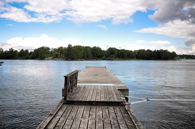 Pier over lake against sky