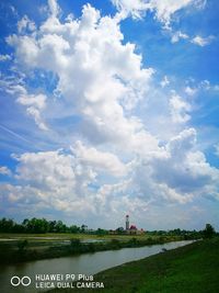 Scenic view of farm against sky