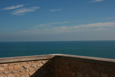 Scenic view of sea against blue sky