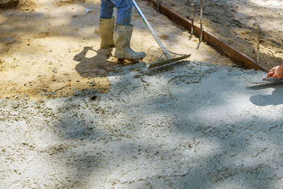 Low section of men working at construction site