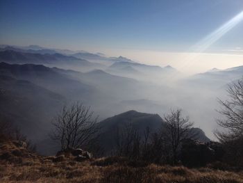 Scenic view of monte resegone against sky during foggy weather