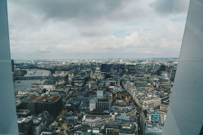 Cityscape against cloudy sky