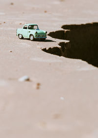 Surface level of toy car on sand