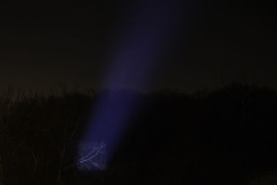 Scenic view of landscape against sky at night