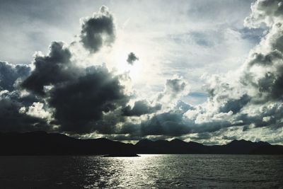 Scenic view of lake against cloudy sky