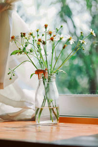 Close-up of flowers in vase on table