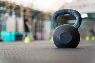 Close-up of kettlebell on floor at gym