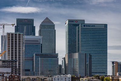 Modern buildings in city against sky