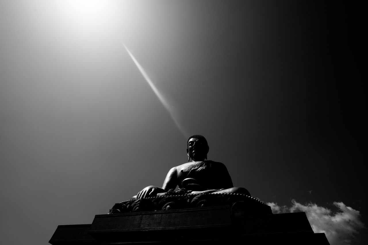 low angle view, sky, architecture, nature, no people, human representation, sculpture, statue, built structure, representation, art and craft, male likeness, religion, outdoors, day, belief, spirituality, building, place of worship, clear sky