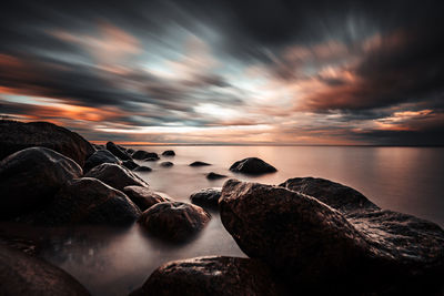 Scenic view of sea against sky during sunset