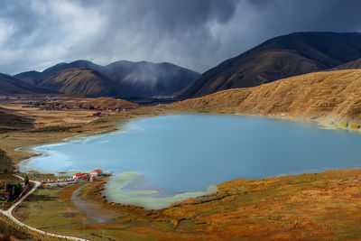 Panoramic view of lake and mountains against sky