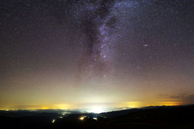 Scenic view of star field against sky at night