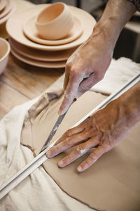 Cropped hands of person working on table