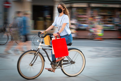 Woman riding bicycle on street