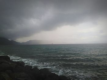 Scenic view of sea against cloudy sky