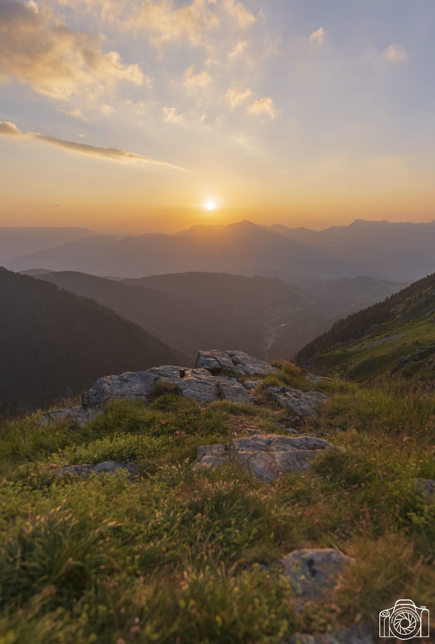 sky, beauty in nature, sunset, mountain, scenics - nature, tranquil scene, tranquility, non-urban scene, nature, environment, cloud - sky, idyllic, plant, landscape, grass, mountain range, land, no people, outdoors, remote