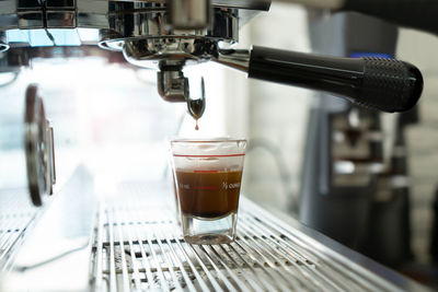 Close-up of coffee served on table at cafe