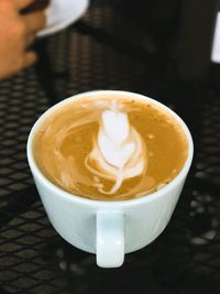 Close-up of cappuccino on table