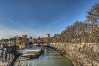 Bridge over river against sky