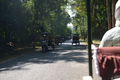 People on road in city