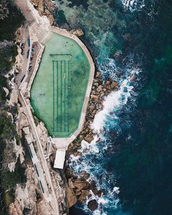 Aerial view of infinity pool by sea