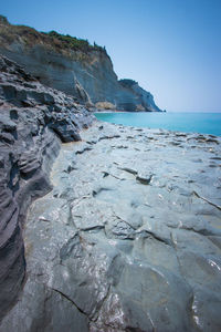 Scenic view of sea against clear blue sky