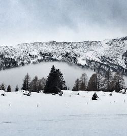 Scenic view of frozen landscape against sky