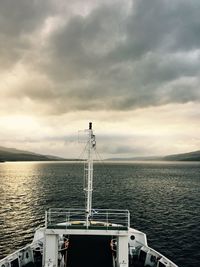 Ship sailing on sea against sky