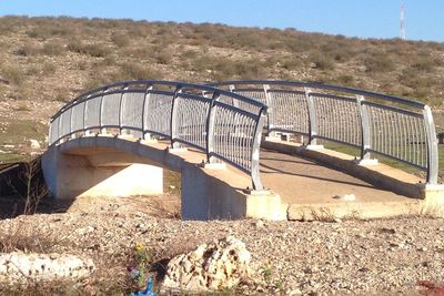 Arch bridge against sky