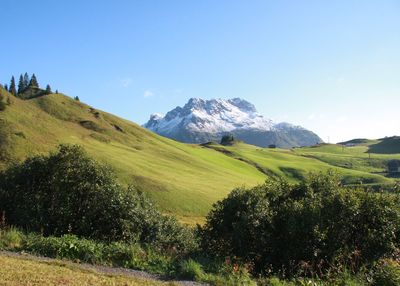 Scenic view of landscape and mountain against sky