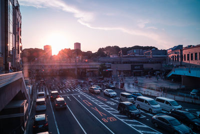 Traffic on city street during sunset