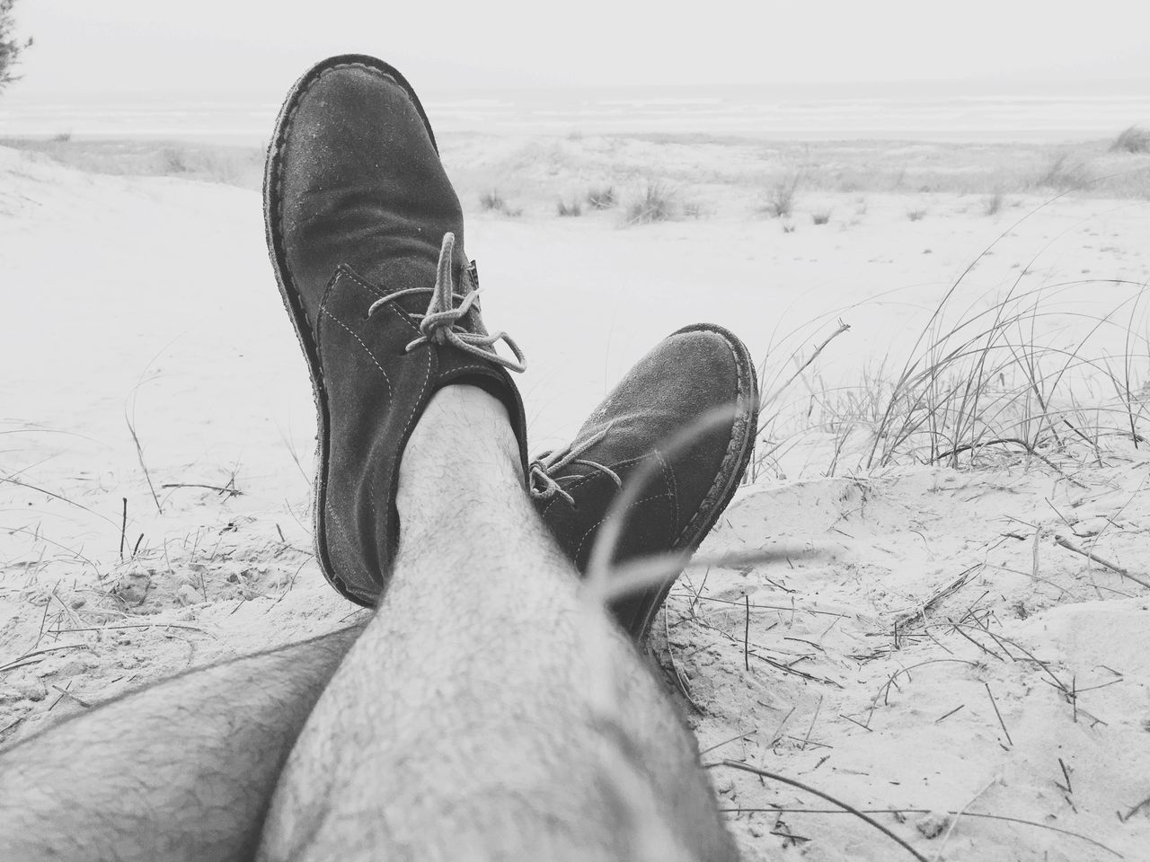 low section, person, shoe, personal perspective, footwear, human foot, lifestyles, part of, jeans, leisure activity, sand, unrecognizable person, field, men, high angle view, day, close-up