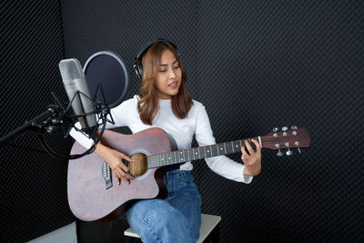 Portrait of a man playing guitar