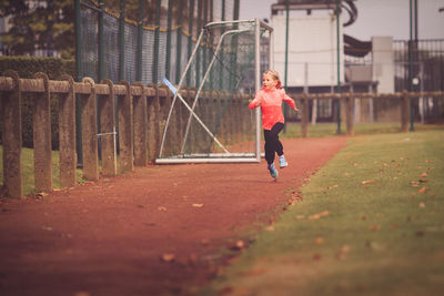 Full length of girl running in park