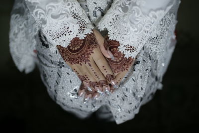 Close-up of human hand against white background