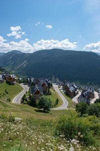 High angle view of buildings and mountains against sky