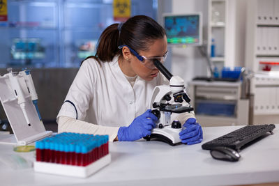 Female dentist working in laboratory